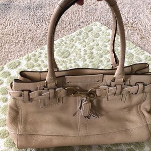 Cream Coach handbag.